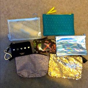 Assorted makeup bags / wallets.